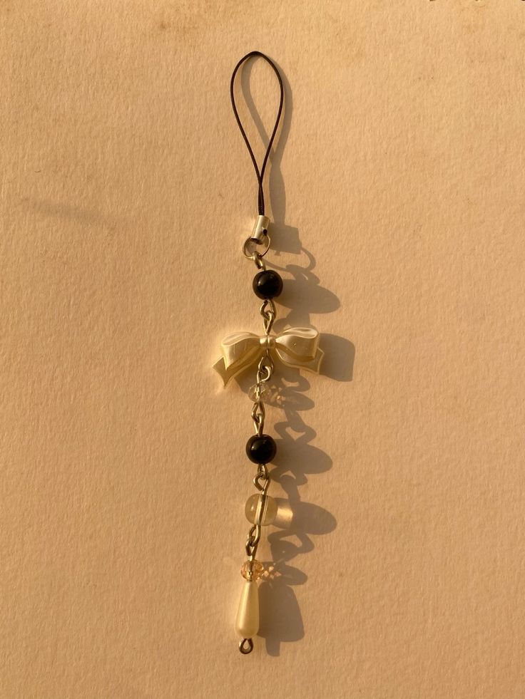 Black bow phone charm