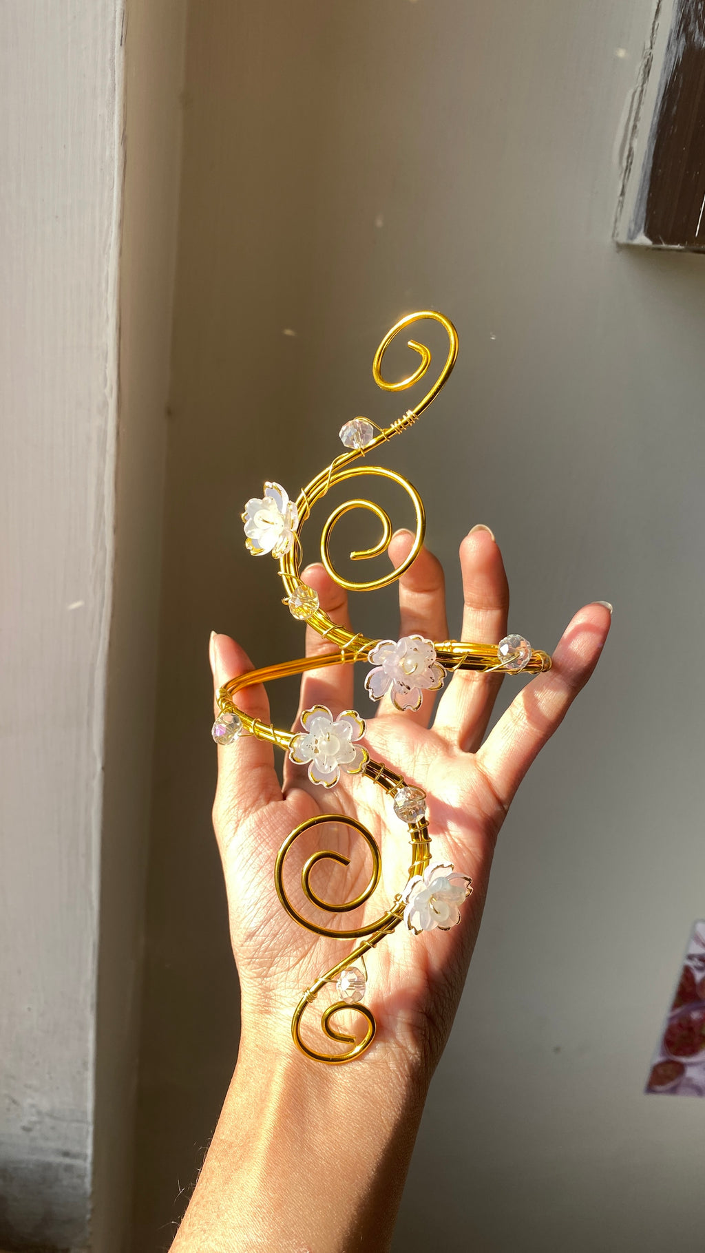White spiral blossom armcuff
