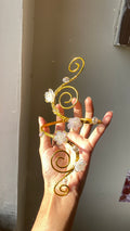 White spiral blossom armcuff