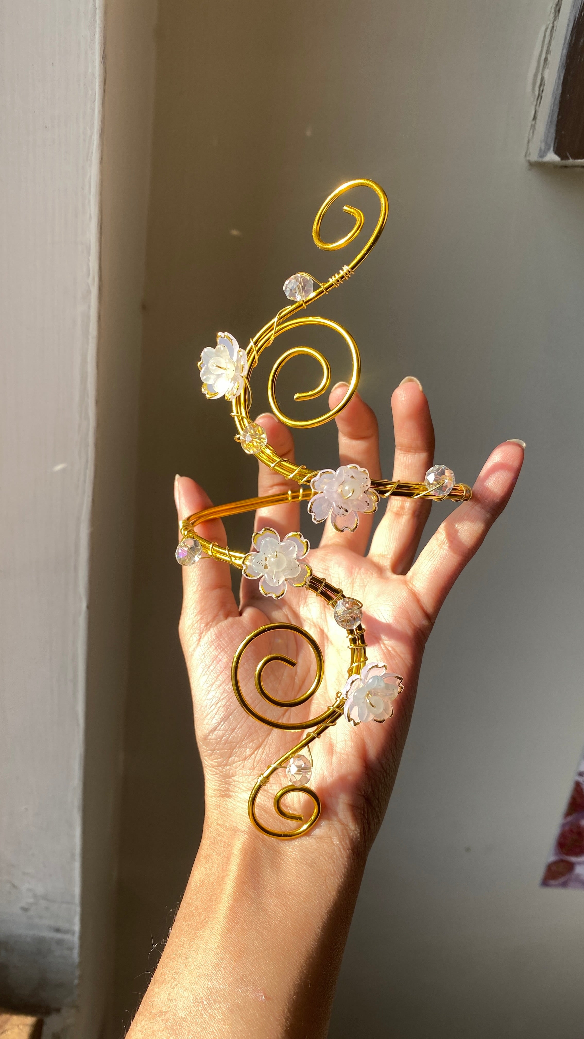 White spiral blossom armcuff