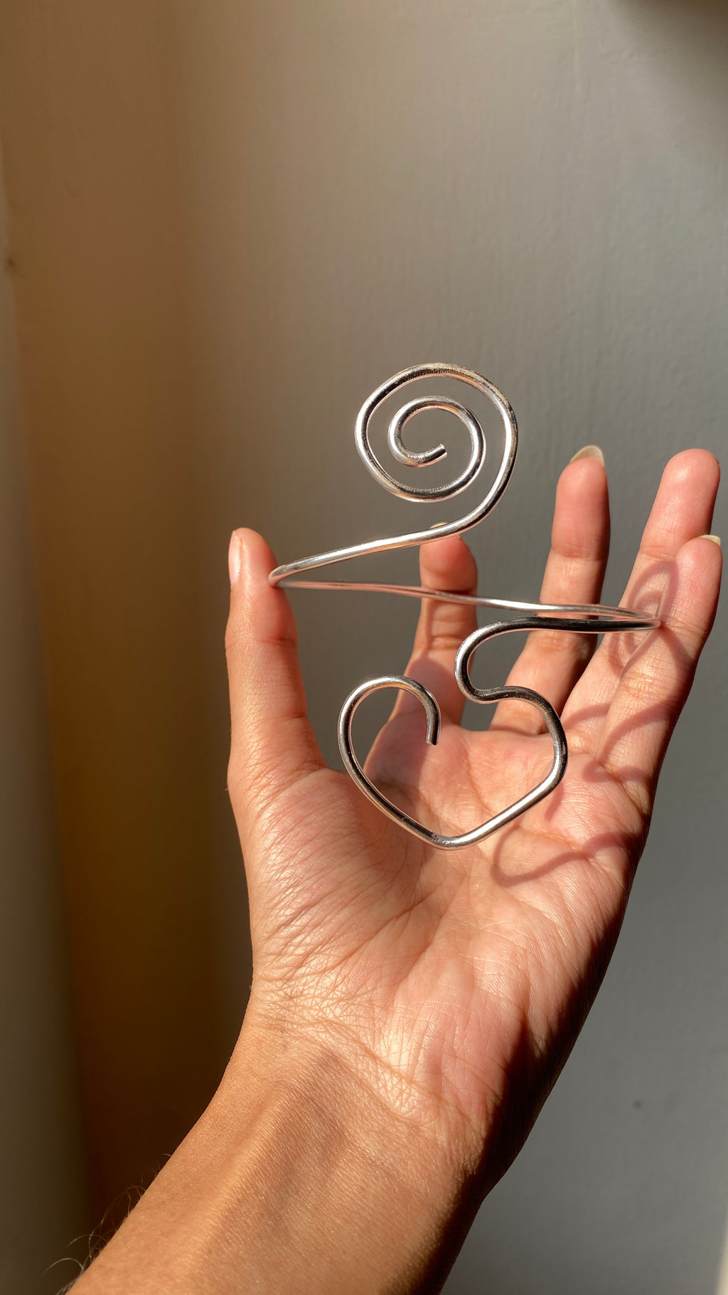 Spiral heart armcuff