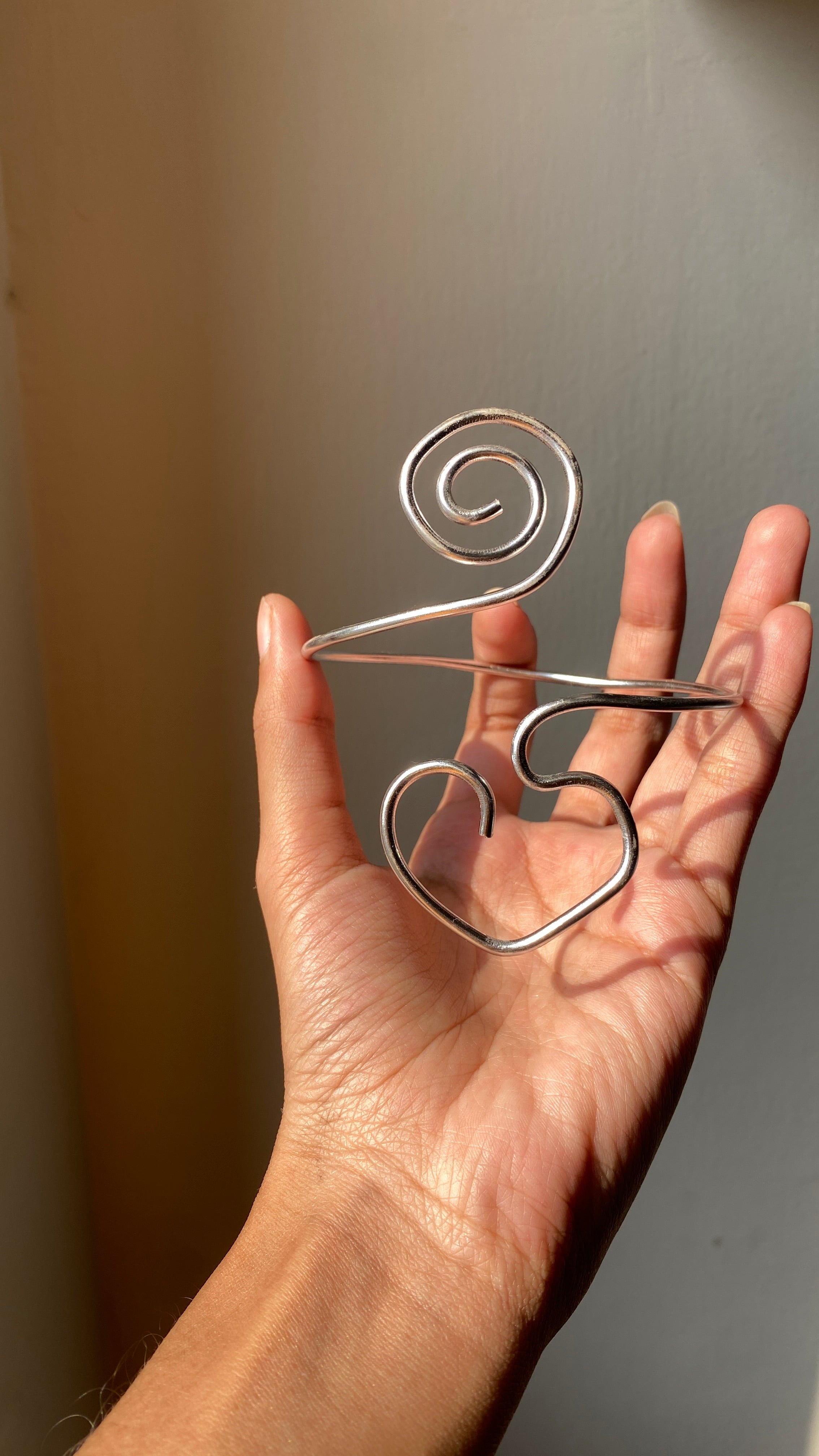 Spiral heart armcuff
