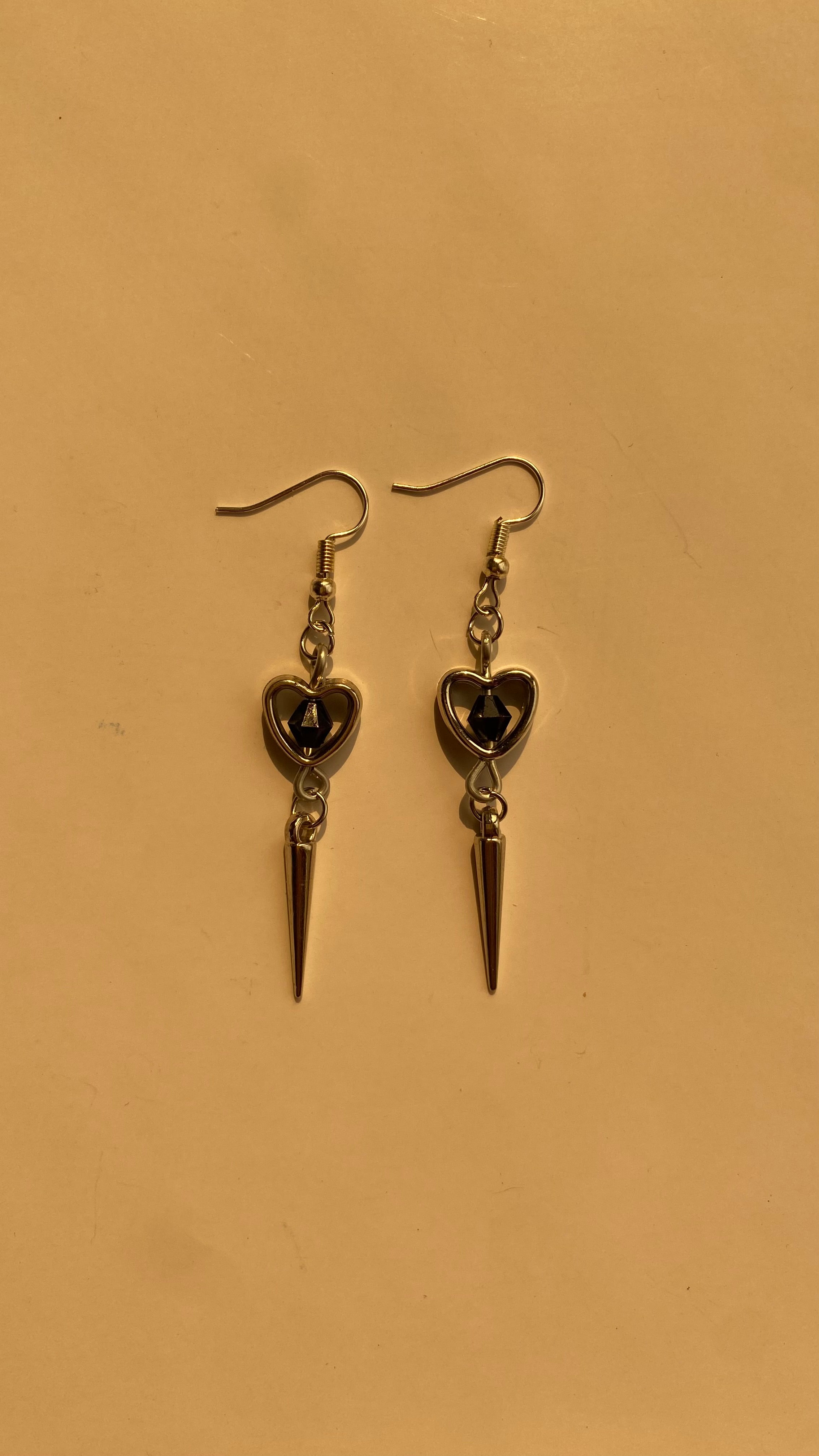 Black heart spike earrings