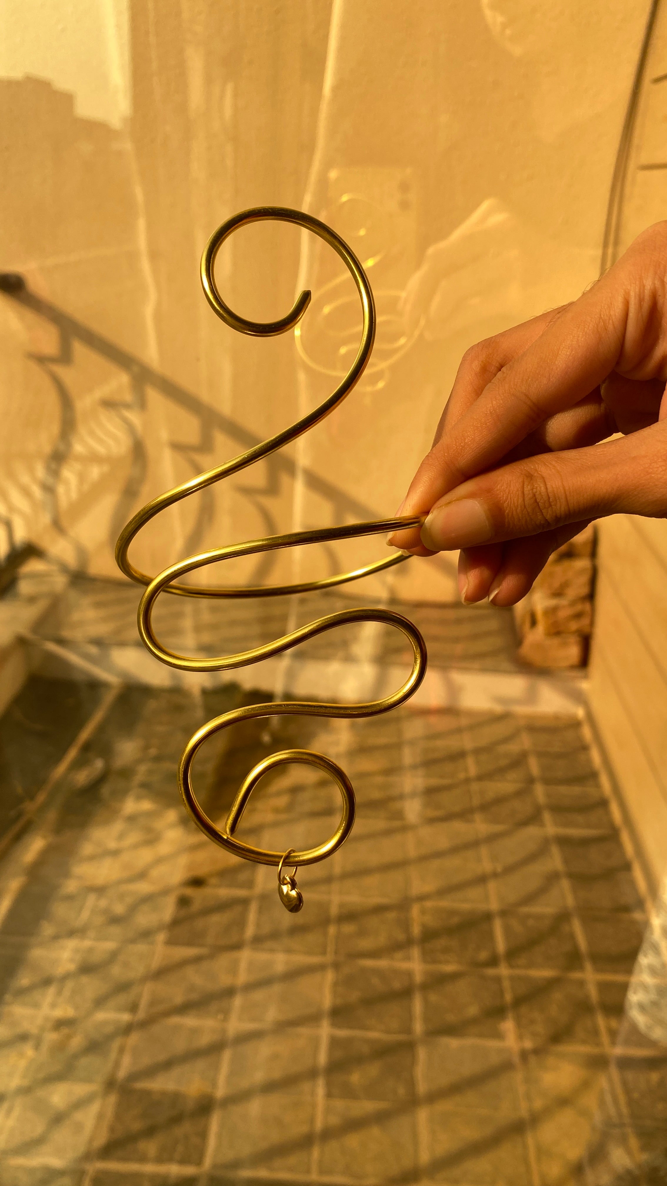 Golden curl armcuff