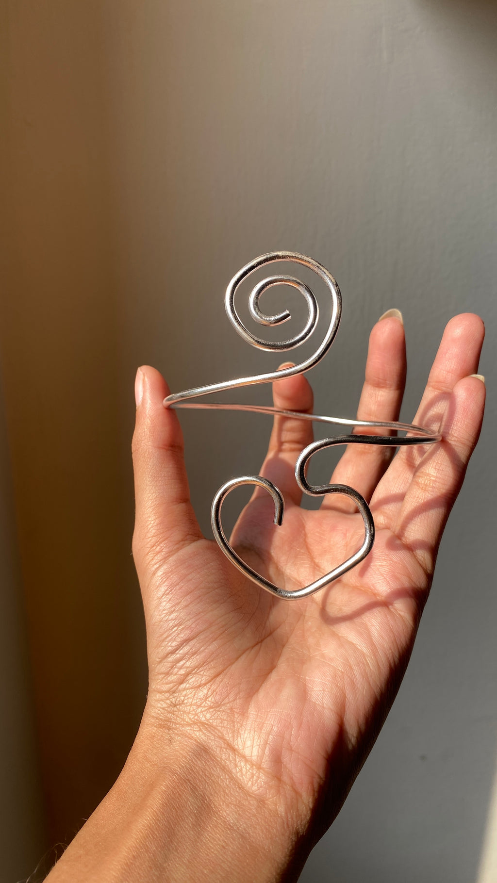 Spiral heart armcuff