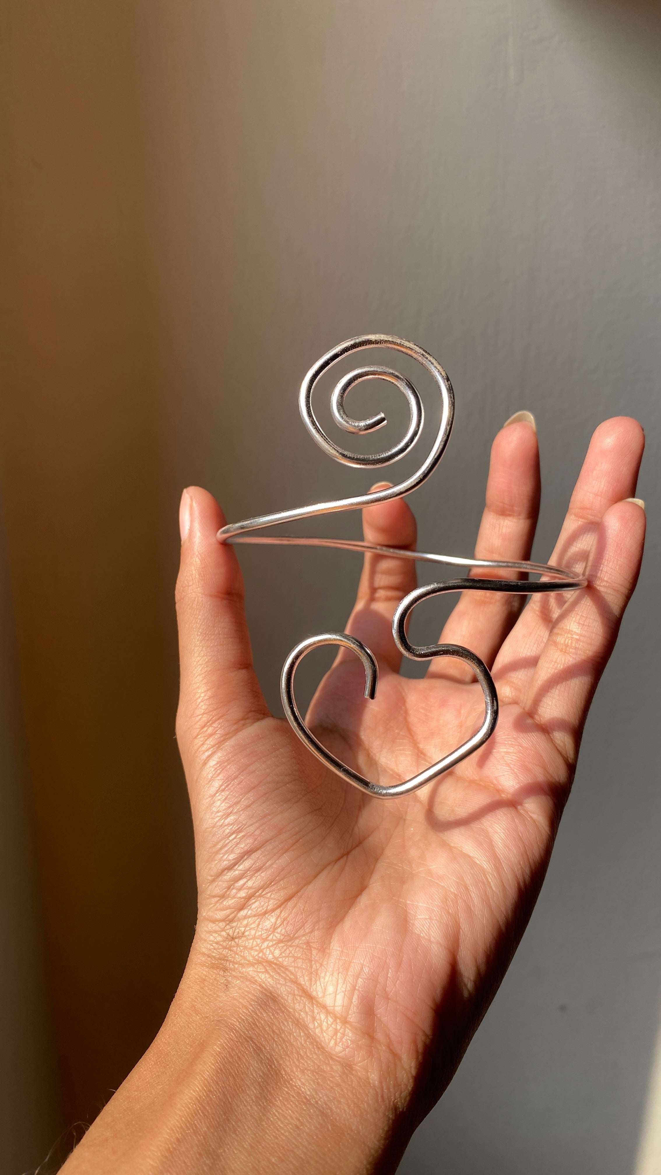 Spiral heart armcuff